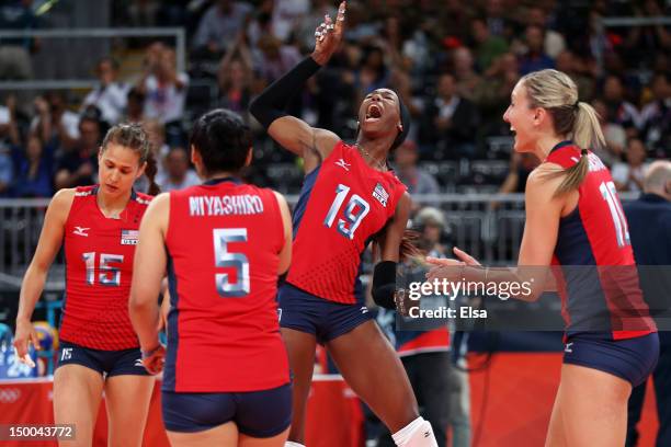 Destinee Hooker, Tamari Miyashiro, Logan Tom and Jordan Larson of United States celebrates after defeating Korea in the Women's Volleyball semifinal...