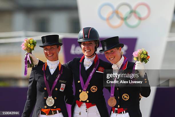 Gold medallist Charlotte Dujardin of Great Britain riding Valegro, silver medallist Adelinde Cornelissen of Netherlands riding Parzival and Laura...