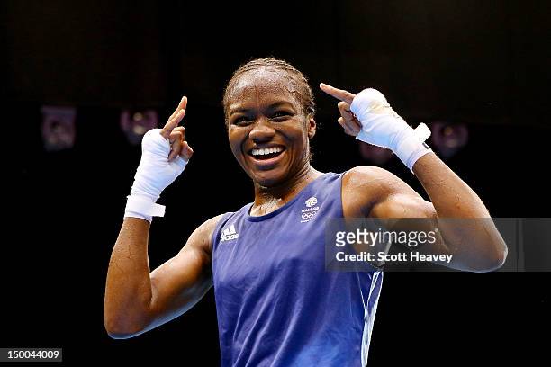 Nicola Adams of Great Britain celebrates winning her bout against Cancan Ren of China during the Women's Fly Boxing final bout on Day 13 of the...