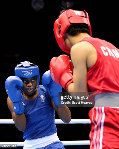 Nicola Adams of Great Britain in action against Cancan Ren of China during the Women's Fly Boxing final bout on Day 13 of the London 2012 Olympic...