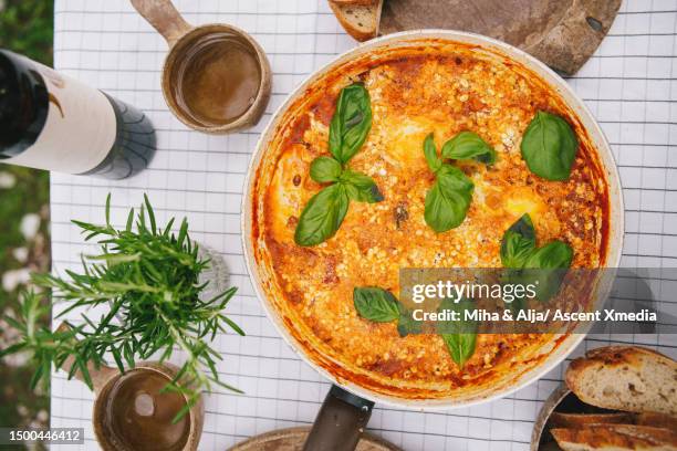 fresh frittata on a picnic table with wine - frittata stock pictures, royalty-free photos & images