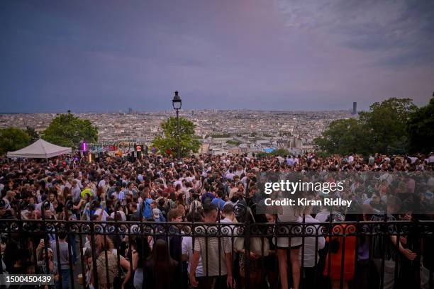 Parisians dance on the steps of Sacré-Coeur overlooking the city of Paris as part of Fête de la Musique, a city wide celebration of free music on...