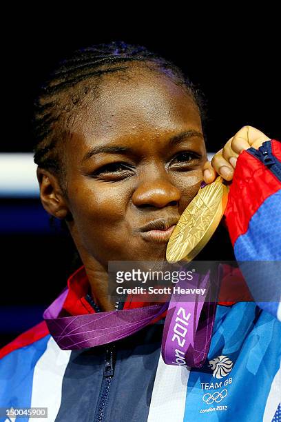 Gold medalist Nicola Adams of Great Britain celebrates on the podium during the medal ceremony after the Women's Fly Boxing final bout on Day 13 of...