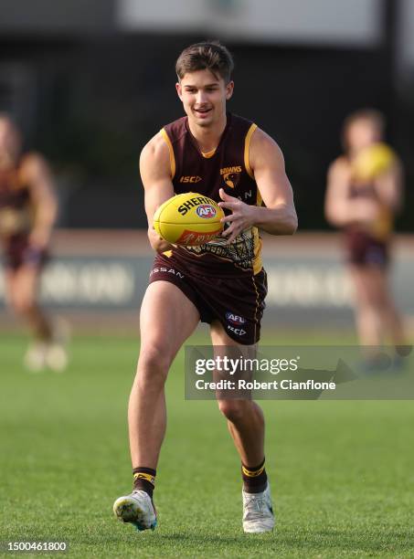 Sam Butler of the Hawks controls the ball during a Hawthorn Hawks AFL training session at Waverley Park on June 22, 2023 in Melbourne, Australia.