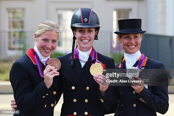 Gold medallist Charlotte Dujardin of Great Britain riding Valegro, silver medallist Adelinde Cornelissen of Netherlands riding Parzival and bronze...