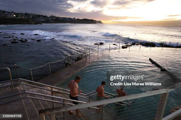 Swimmers take a sunrise dip at Bronte Beach sea pool on June 22, 2023 in Sydney, Australia. The mercury has dipped to historic lows in Sydney in...