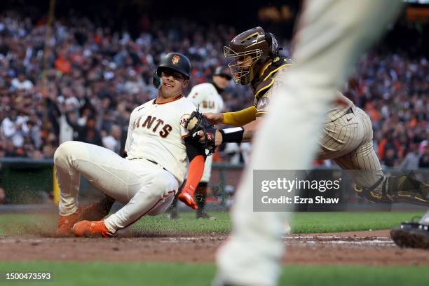 Gary Sanchez of the San Diego Padres tags out Blake Sabol of the San Francisco Giants in the fifth inning on June 21, 2023 in San Francisco,...