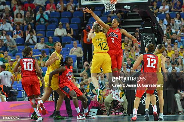 Belinda Snell of Australia shoots against Maya Moore of the United States during their Basketball Game on Day 13 of the London 2012 Olympic Games at...