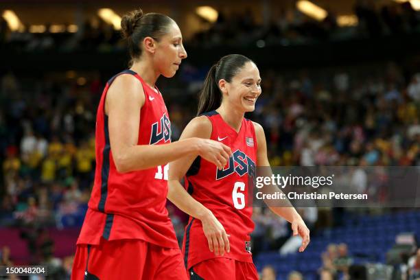 Diana Taurasi and Sue Bird of United States celebrate as they walk off the court following their 86-73 victory over Australia in the Women's...