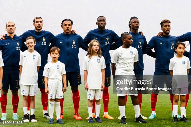 Antoine Griezmann of France and Theo Hernandez of France sings the National Anthem with his teammates during the UEFA EURO 2024 qualifying round...