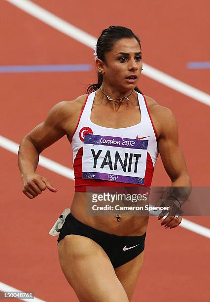 Nevin Yanit of Turkey competes in the Women's 100m Hurdles Semifinals on Day 11 of the London 2012 Olympic Games at Olympic Stadium on August 7, 2012...