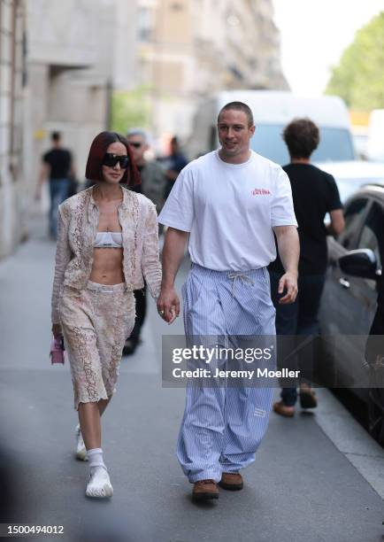 Alexandra Guerain is seen wearing a matching Acne Studios two piece with a beige jacket and beige capri pants, Miu Miu white bra, Acne Studios pink...