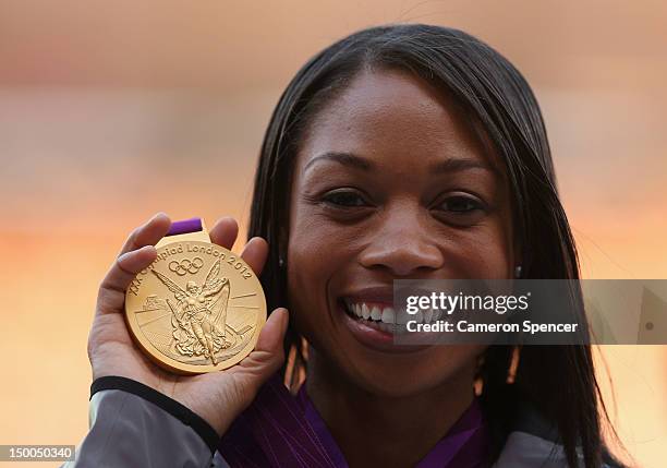 Gold medalist Allyson Felix of the United States poses on the podium during the medal ceremony for the Women's 200m on Day 13 of the London 2012...