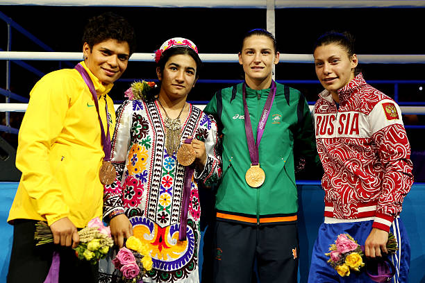 Bronze medalist Adriana Araujo of Brazil, bronze medalist Mavzuna Chorieva of Tajikistan, gold medalist Katie Taylor of Ireland and silver medalist...