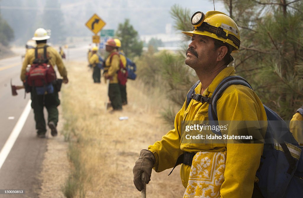 Pedro Rico, with the Lava River crew from Oregon, keeps an eye on a back burn on the Springs Fire in Idaho, near the intersection of Idaho 55 and the Banks-Lowman highway, August 8, 2012. The more than 2,500-acre Springs Fire jumped the South Fork of the Payette. (Katherine Jones/Idaho Statesman/Tribune News Service via Getty Images)