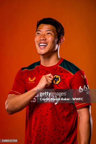 Hee-chan Hwang of Wolverhampton Wanderers poses for a portrait in the Wolverhampton Wanderers 2023/2024 away kit at The Sir Jack Hayward Training...