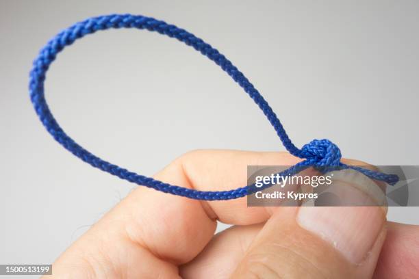 knotted string - fingertier stock pictures, royalty-free photos & images