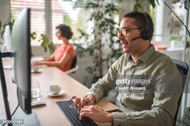 customer support expert: hispanic male call center representative at work - callcenter bildbanksfoton och bilder