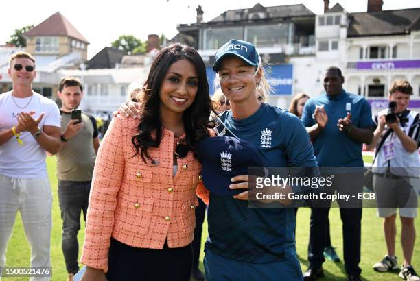 Danni Wyatt of England is presented with their Test Cap by Isa Guha ahead of day one of the LV= Insurance Women's Ashes Test match between England...
