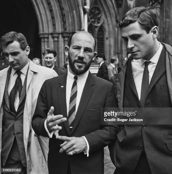Racing driver Stirling Moss outside the law courts in London after his successful divorce petition, May 10th 1963.