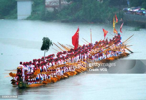 Rowers attend a dragon boat race to celebrate the Dragon Boat Festival on June 22, 2023 in Yiyang, Hunan Province of China. A series of activities...