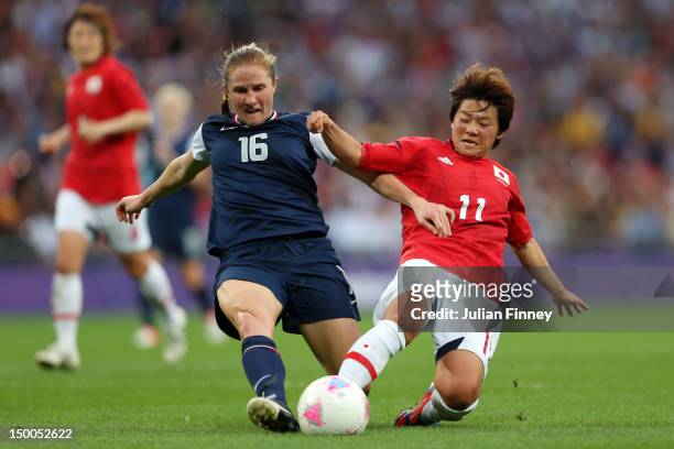 Rachel Buehler of United States and Shinobu Ohno of Japan go after the ball in the first half during the Women's Football gold medal match on Day 13...