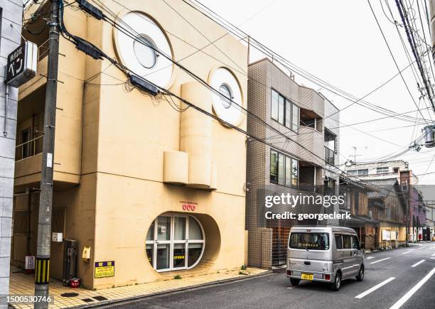 unique 'face house' building in kyoto - storefront-for-art-and-architecture stock pictures, royalty-free photos & images