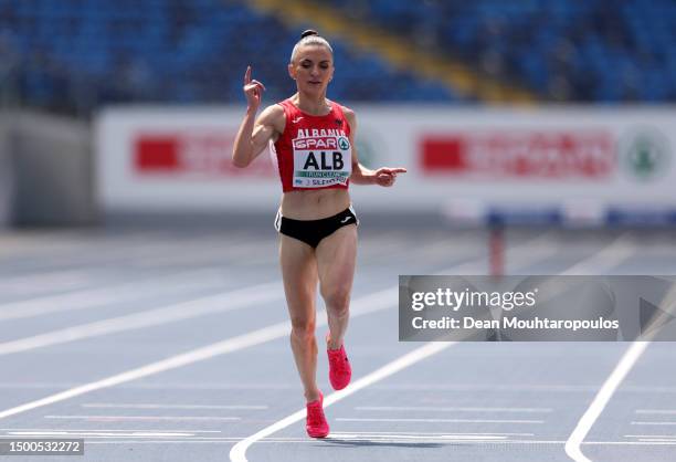 Luiza Gega of Albania celebrates after crossing the finish line in the Women's 3000m Steeplechase - Div. 3 during day three of the European Games...