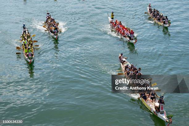 Participants take part in a race during the Dragon Boat Festival on June 22, 2023 in Hong Kong, China. The Dragon Boat Festival is a significant...