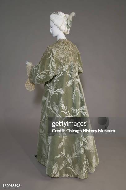 Bertha Palmer's evening coat, ca 1902 . Silk satin with cut velvet in wheat pattern, metallic thread lace, silk metallic tassels by Worth. Bertha...