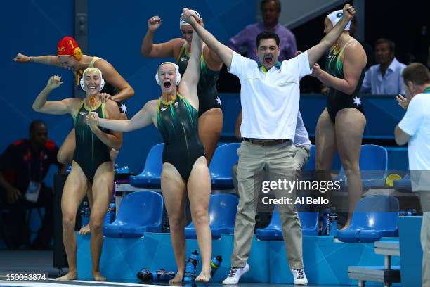 Australian coaching staff and players celebrate winning the Women's Water Polo Bronze Medal match between Australia and Hungary on Day 13 of the...