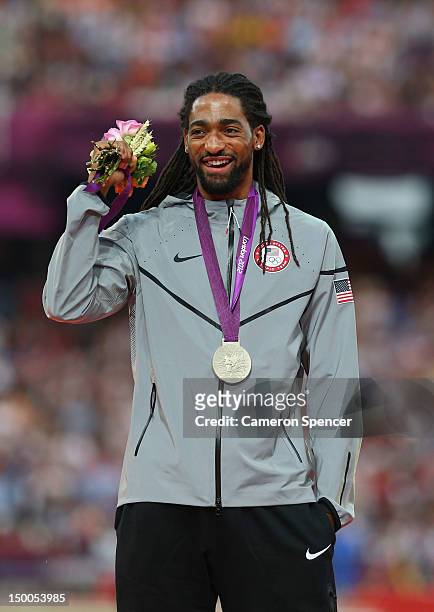 Silver medalist Jason Richardson of the United States poses on the podium during the medal ceremony for the Men's 110m Hurdles on Day 13 of the...