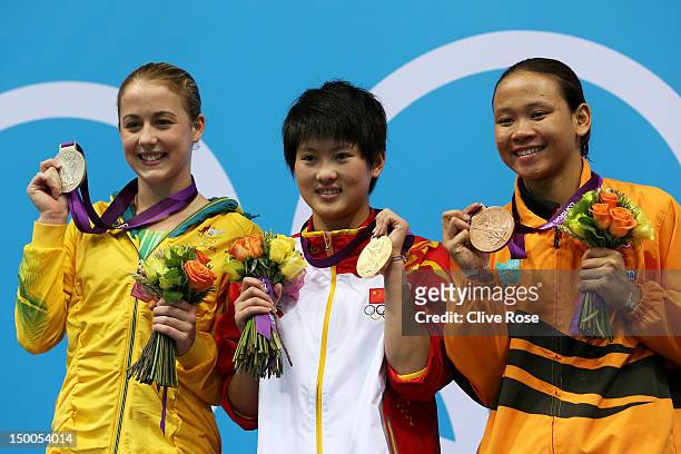 Silver medallist Brittany Broben of Australia, gold medallist Ruolin Chen of China, and bronze medallist Pandelela Pamg of Malaysia pose on the...