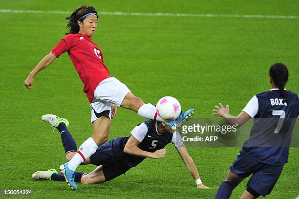 Japan's forward Yuki Ogimi fights for the ball with United States's defender Kelley O'Hara during the final of the women's football competition of...
