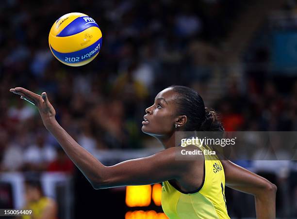 Fabiana Claudino of Brazil serves the ball in the third set against Japan during the Women's Volleyball semifinal match on Day 13 of the London 2012...
