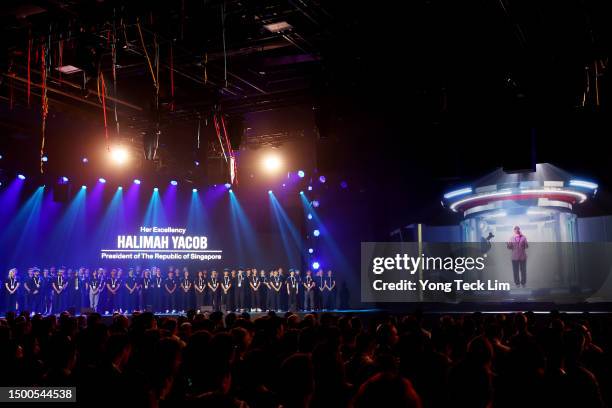 Singaporean President Halimah Yacob delivers an opening speech via a digital projection during the opening ceremony on day one of the Olympic Esports...