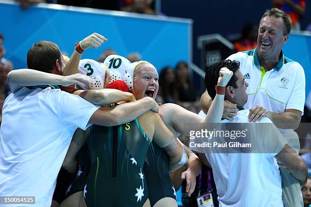 Australian players and coaching staff celebrate winning the Women's Water Polo Bronze Medal match between Australia and Hungary on Day 13 of the...