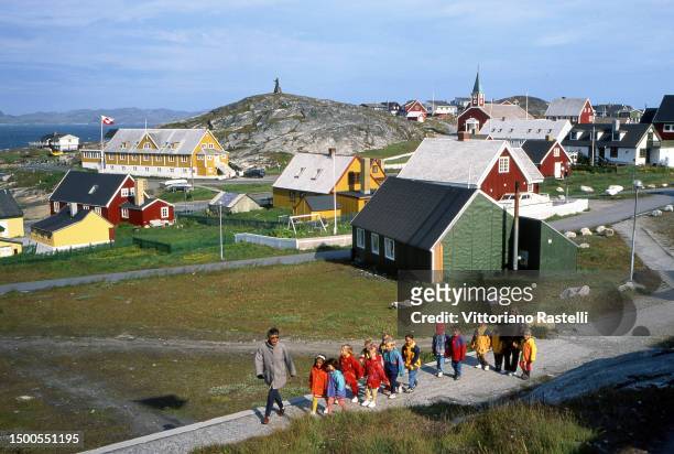 Children with their teachers at a school during a walk in the city, Nuuk, Greenland.