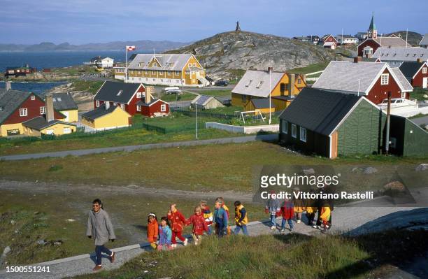 Children with their teachers at a school during a walk in the city, Nuuk, Greenland.