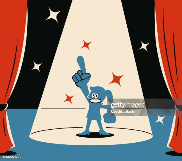 a smiling blue woman gives a perfect number 1 hand gesture on stage with a spotlight - party host stock illustrations