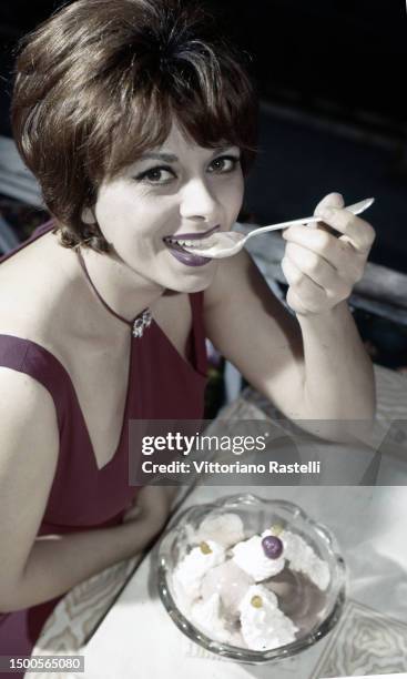 Rome, Italy, July 1962, Italian actress Sandra Milo with much food to be able to get fat to play the film 8/2 by the director Federico Fellini.