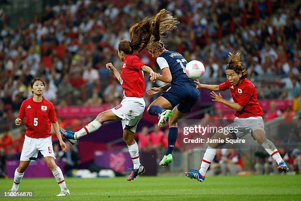 Homare Sawa of Japan battles for the ball with Alex Morgan of the United States during the Women's Football gold medal match on Day 13 of the London...
