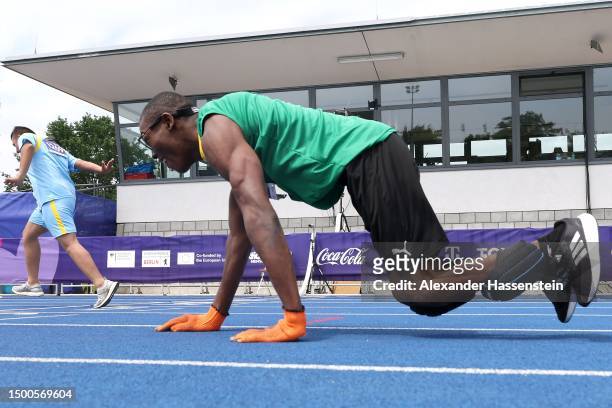 Kirk Wint of Jamaica finished with Omer Al Jumaili of Iraq the 50m Men Final Plus at the Athletics Track and Field competition during day six of...