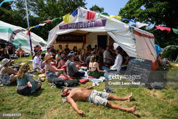 Festival-goers take part in a meditation class on Day 2 of Glastonbury Festival 2023 on June 22, 2023 in Glastonbury, England.
