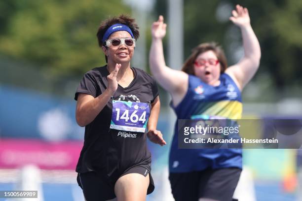 Flordeliza Baento of Philippines finished with Miriam Holmes of Australia the 50m Women Final at the Athletics Track and Field competition during day...