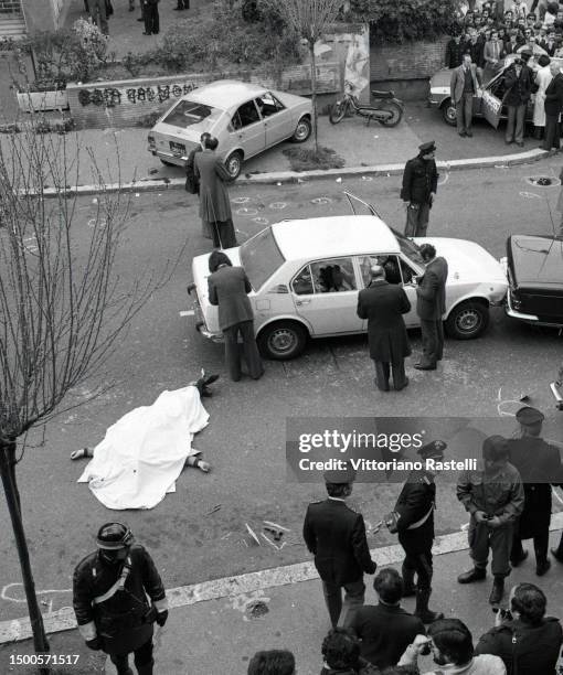 Covered in a white cloth, a policeman killed in via Fani, site of the kidnapping of Aldo Moro by the Red Brigades in Rome, Italy, on March 16, 1978.