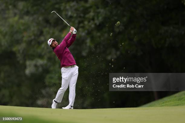 Hideki Matsuyama of Japan plays an approach shot on the 14th hole during the first round of the Travelers Championship at TPC River Highlands on June...