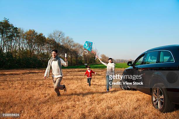 family in autumn - car park stock-fotos und bilder