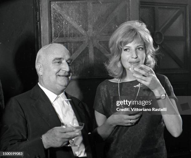 Rome, Italy, August 1961, the film producer and publisher Angelo Rizzoli with the actress Monica Vitti on the set of the film L'eclissi.