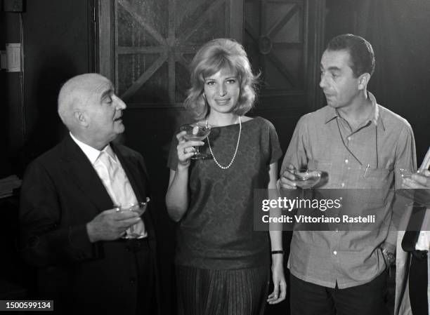 Rome, Italy, August 1961, Producer Angelo Rizzoli with actress Monica Vitti and director Michelangelo Antonioni on the set of the film L'eclissi.